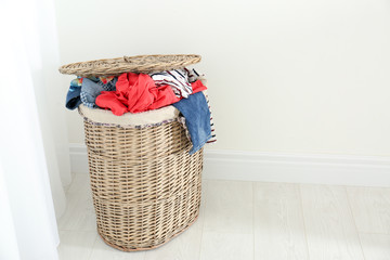 Wall Mural - Bin with dirty clothes prepared for laundry indoors