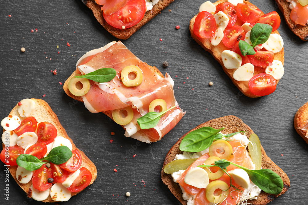 Slate plate with tasty bruschettas, closeup