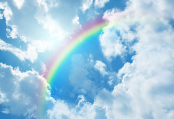 Wall Mural - rainbow in blue sky.