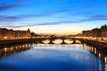 Wall Mural - Panoramic view of Florence Tuscany City, Housing, Buildings and Ponte alla Carraia and Arno River with Twilight sky scene in the night image