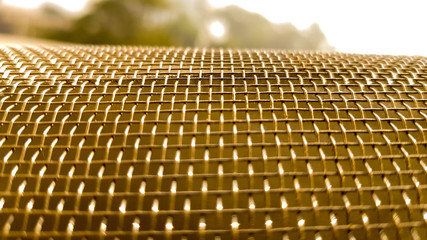 Gold mesh net with focus and shallow depto fo field, gold bokeh net pattern
