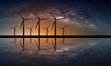 Fototapeta Londyn - Landscape with Milky way galaxy. Night sky with stars and silhouette wind turbine on the mountain.
