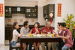 © DragonImages - Family celebrating Tet