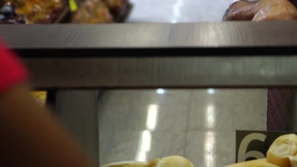 Wall Mural - Senior Man Ordering Bread at Supermarket