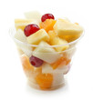 fresh fruit pieces salad in plastic cup