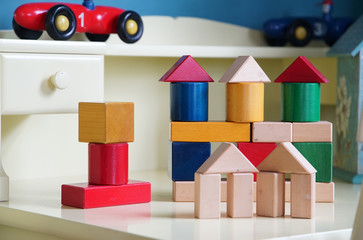 Wall Mural - Colorful building block on the table of the room