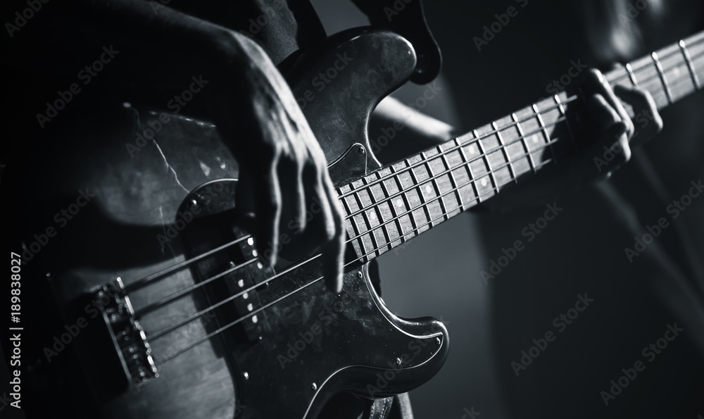 Electric bass guitar black and white photo - obrazy, fototapety, plakaty 