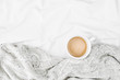 © igishevamaria - Cup of coffee on bed with warm plaid. Copy space. Flat lay, top view