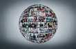 © ASDF - A globe is isolated on a white background with many different business people