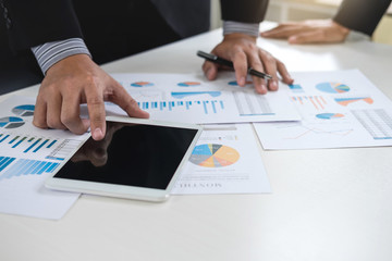 Co working conference, Business team meeting present, investor colleagues discussing new plan financial graph data on office table with laptop and digital tablet, Finance, accounting, investment