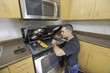 © spatesphoto - Appliance Technician Checking His Meter