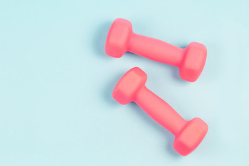 Wall Mural - Dumbbell in the blue background