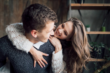 Couple playing piggyback on beach. Newlyweds laughing and go crazy. Artwork. Soft focus