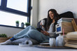 © lordn - Beautiful young woman at home drinking coffee reading a book