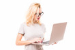 © dianagrytsku - Happy woman typing on the laptop isolated on white background