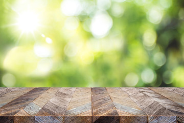 Aufkleber - Empty old grunge wood plank table top with blur green tree in park bokeh sunlight,Mock up for display or montage of product,Banner or header for advertise on social media,Spring background.
