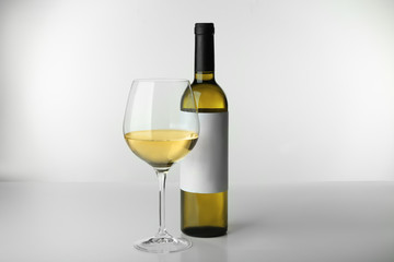 Wall Mural - Wine bottle mock up and glass on white background