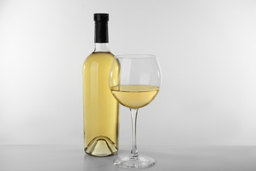 Sticker - Bottle of wine and glass on white background