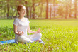 © chompoo - Young Asian woman practicing yoga  at the Green park ,  Healthy lifestyle Concept.