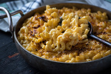 Gourmet Baked Macaroni And Cheese Noodles In Rustic Cast Iron Dish