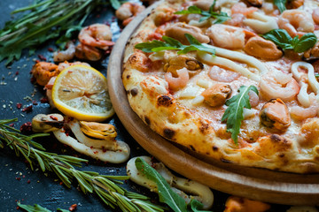 Wall Mural - Seafood pizza. Traditional italian cuisine. Fast and tasty dinner concept