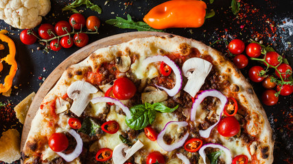 Wall Mural - Bolognese pizza with minced meat and cherry tomatoes. Nutritional italian restaurant dish