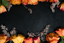 Autumn Wedding Flowers Decor. Orange Roses With Silver Adornment On Black Background. Elegant And Seasonal Reception Party Flower Arrangement