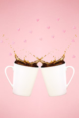 Two levitating coffee mugs with splashes and heart confetti. Coffee concept. Minimal art trend. Solid pink background