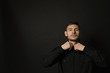 © alexbutko_com - Handsome and positive guy in a black shirt on a black background