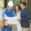© alotofpeople - Worker shows house design plans