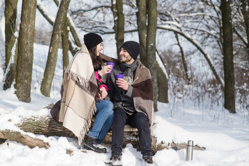  Young romantic couple dating in the winter forest