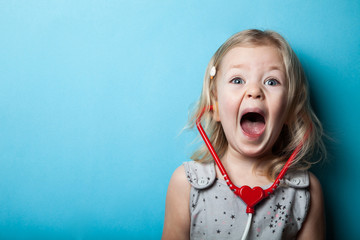 Cute little girl is playing doctor. Emergency.