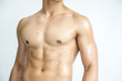 © thaninee - Muscle of body builder on white background