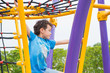 © weedezign - kid boy having fun to play on children's climbing toy at school playground,back to school activity.kindergarten preschool.