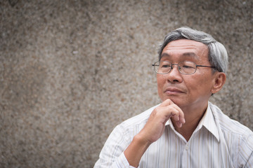 Wall Mural - thoughtful old man thinking, senior planning with idea, positive retired pensioner portrait