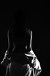 © Jade - Body of Woman with black panty turn body without bra and beast to show side rear view, concept black white low key exposure silhouette.