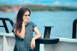 Sea sick woman suffering motion sickness while on boat