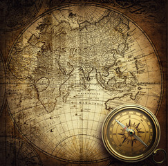 Fototapete - Compass on vintage map. Adventure, travel, stories background. 
