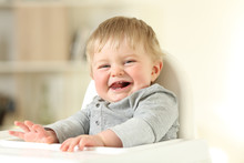 Joyful Baby With His First Teeth Looking At You