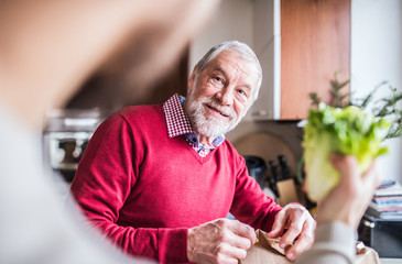 Poster - Hipster son with his senior father in the kitchen.