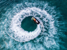 People Are Playing A Jet Ski In The Sea.Aerial View. Top View.amazing Nature Background.The Color Of The Water And Beautifully Bright. Fresh Freedom. Adventure Day.clear Turquoise At Tropical Beach.
