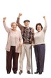 © Ljupco Smokovski - Three cheerful seniors holding their hands up
