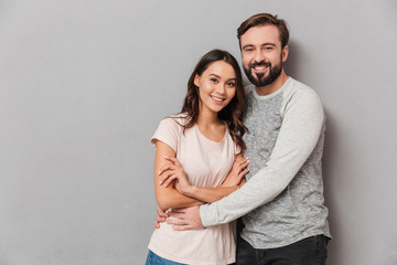 Poster - Portrait of a smiling young couple hugging