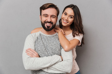 Poster - Portrait of a beautiful young couple hugging