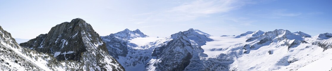 landscape of mountains in winter with blue sky