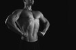 © Prostock-studio - Strong athletic man showes naked muscular body