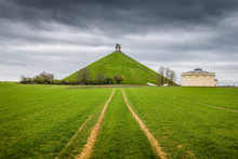 Famous Battle Of Waterloo Lion's Mound Memorial Site With Dark Clouds, Belgium