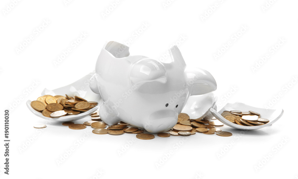 Broken piggy bank with money on white background