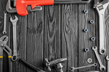 Wall Mural - Plumber's tools on wooden background