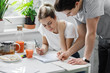 © LUMINA IMAGES - Young man and woman students studying together at home.
